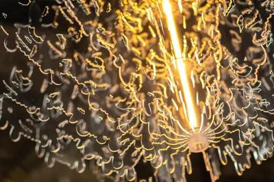 a close up of a chandelier with lights at The Clock Tower in Weesp