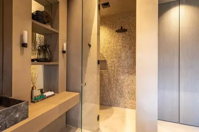 a shower with a glass door in a bathroom at The Clock Tower in Weesp