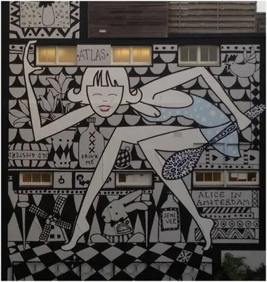 a painting of a woman on a wall at Prince On The Roof in Amsterdam