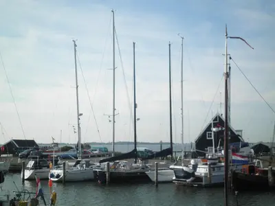 a group of boats docked in a harbor at B&B HutSpot in Amsterdam