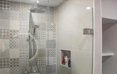 a shower with a glass door in a bathroom at The Blue Whale in Bergen aan Zee