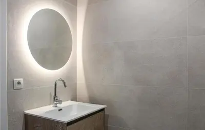 a bathroom with a sink and a mirror at The Blue Whale in Bergen aan Zee