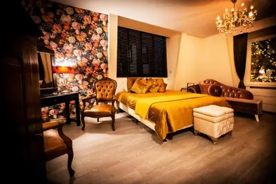 a bedroom with a bed and a table and chairs at Mylos Studios in Alkmaar