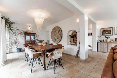 a dining room with a table and chairs at Family Villa behind the Beach in Zandvoort