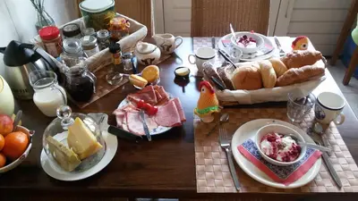 a table with plates of food on top of it at Boerderij Hazenveld in Kockengen