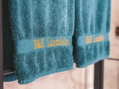 a close up of blue towels on a rack at B&B Landslake I in Landsmeer