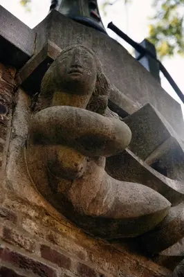 a statue of a woman on the side of a building at LOFT 188 Luxury Apartment Hotel in Utrecht