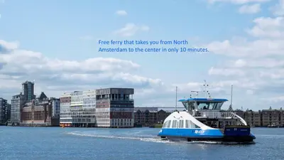 a blue and white boat in the water near a city at Houseboat apartment with water terrace, free bikes & fast wifi in Amsterdam