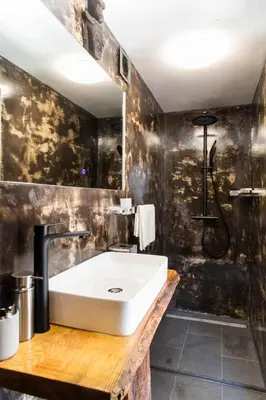a bathroom with a sink and a shower at Luna’s loft in Bergen