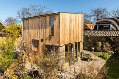 a wooden house sitting on top of a yard at Luna’s loft in Bergen