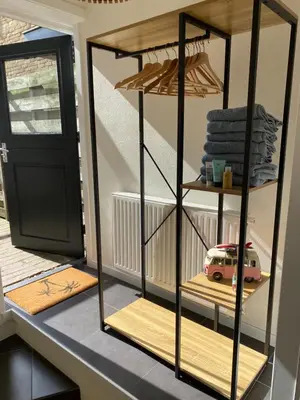 a room with a shelf with a toy car on it at ‘T Vissershuisje in Zandvoort