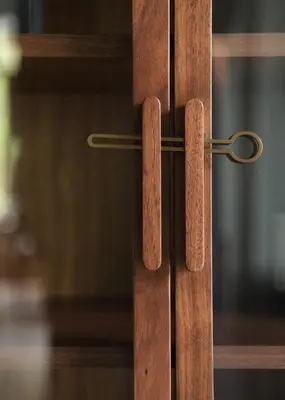 a close up of a wooden door with a handle at Boutique Hotel Benedict Noordwijk in Noordwijk aan Zee