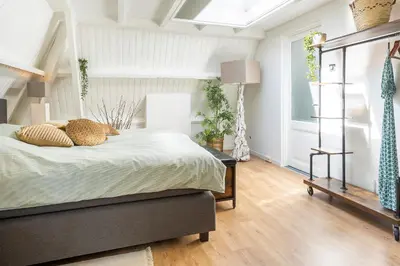 a bedroom with a bed and a window at Zandvoort-17 in Zandvoort