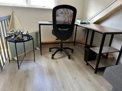 an office with a desk and a chair and a table at Zomerhuis 
