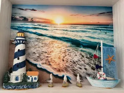 a picture of a lighthouse on the beach at Zomerhuis 