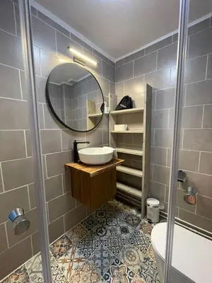 a bathroom with a sink and a mirror at Gartenblick in Zandvoort
