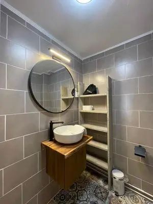 a bathroom with a sink and a mirror at Gartenblick in Zandvoort