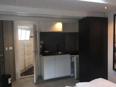 a kitchen with a sink and a counter top at Centre beach lodge (2) in Zandvoort