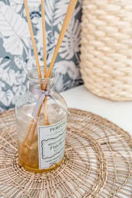 a jar of honey with sticks sticking out of it at Hippie Beach in Zandvoort