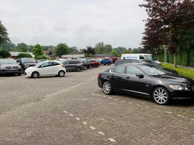 a bunch of cars parked in a parking lot at Family Escape Near Keukenhof in Noordwijkerhout