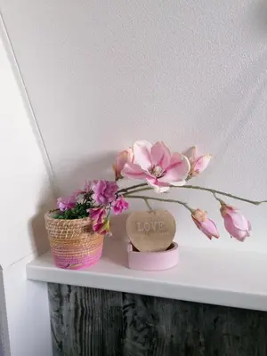 a white shelf with a vase with flowers on it at 4T4 Apartment B in Egmond aan den Hoef