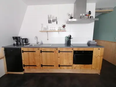 a kitchen with a sink and a counter top at 4T4 Apartment B in Egmond aan den Hoef