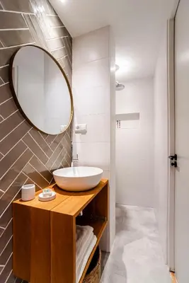 a bathroom with a sink and a mirror at The Shell Apartment in Zandvoort