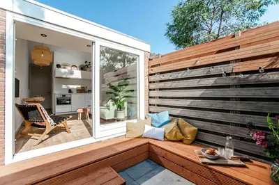an outdoor patio with a large sliding glass door at SeatheDunes in Zandvoort