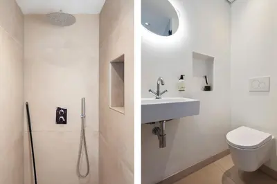 a bathroom with a shower and a sink and a toilet at Beach Studio Zen in the Centre of Zandvoort in Zandvoort