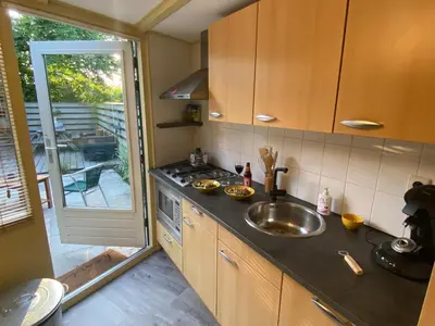 a kitchen with a sink and a counter top at Happy Little Maya Bee in Nieuwe-Niedorp