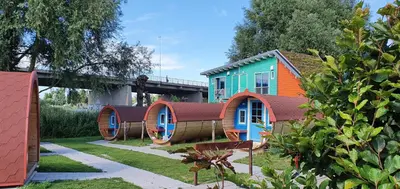 a row of cottages in the yard of a house at Camping Zeeburg Amsterdam in Amsterdam