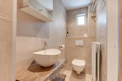 a bathroom with a bowl sink and a toilet at The Forester Schoorl in Schoorl