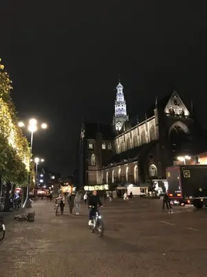 a large building with a clock tower at night at De Haarlemse Logeerkamer in Haarlem