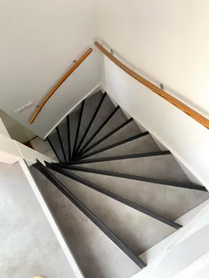 a spiral staircase in a house at Home Inn Zandvoort the First Floor 4 Persons, 2 bedrooms, Free Parking! in Zandvoort