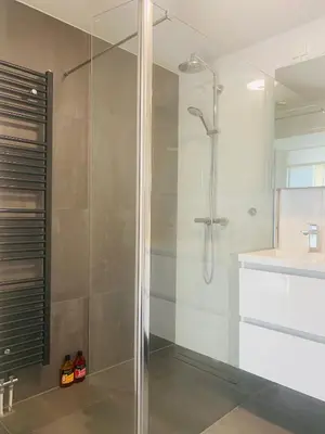 a bathroom with a shower and a sink at Home Inn Zandvoort the First Floor 4 Persons, 2 bedrooms, Free Parking! in Zandvoort