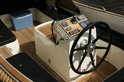 a boat with a steering wheel on the deck at Eelhouse private studio in Amsterdam