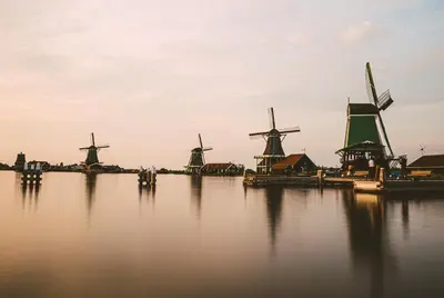 a group of windmills sitting in the water at Eelhouse private studio in Amsterdam