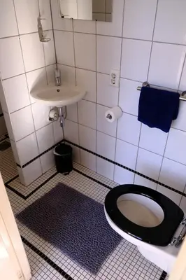 a bathroom with a toilet and a sink at Eelhouse private studio in Amsterdam