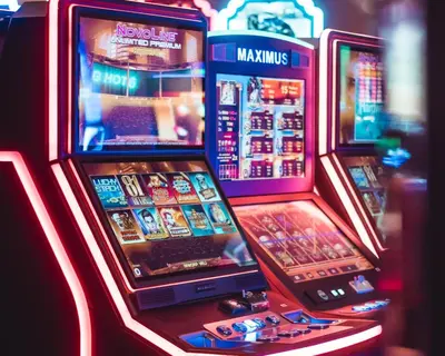 two slot machines in a casino with their screens at HOTELUX Amsterdam Airport Hotel in Hoofddorp