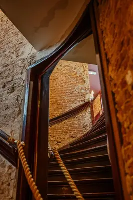 a reflection of a brick wall in a mirror at MAF Haarlem Boutique Hotel in Haarlem
