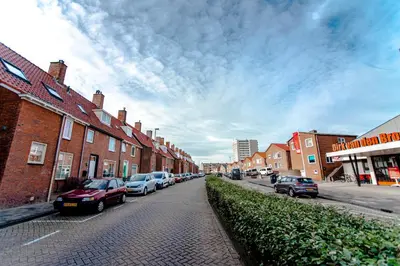 a street with cars parked on the side of the road at Seawave Studio in Zandvoort