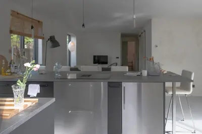 a kitchen with a large island in a room at Appartementen Zer en Loft in centrum Bergen in Bergen