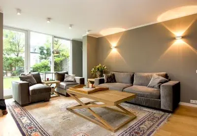 a living room with a couch and a table at Time Out Beach House in Zandvoort