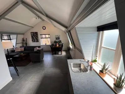 a view of a kitchen and living room in a house at Appartement Warmond in Warmond