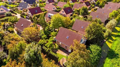 an aerial view of a residential neighborhood with houses at Huisje Avondrood in Schoorl