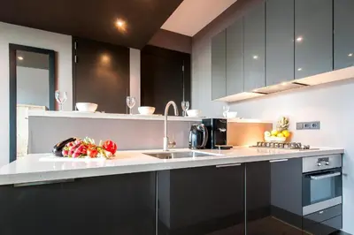 a kitchen with a counter with fruits and vegetables on it at Hotel Mosaic Apartments in Amsterdam