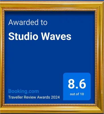 a picture frame with the text awarded to studio waves at Studio Waves in Egmond aan Zee