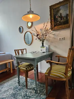 a dining room with a table and two chairs at Waterfront Studio in Amsterdam