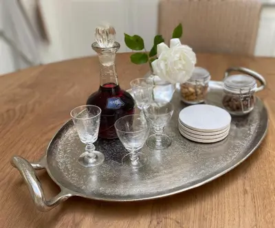 a tray with glasses and a bottle of wine on a table at Bed and Breakfast Amsterdam in Amsterdam