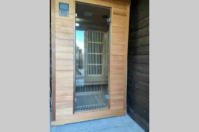 a front door of a house with a window at Casa The Wave with infrared sauna in Noordwijkerhout